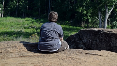 Elyse sits on a rock [01]