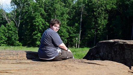 Elyse sits on a rock [02]