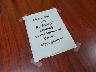 No sitting or leaning on the tables or chairs