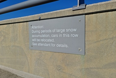 Sign about car relocation in snow