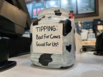 Cow-themed tip jar at Starbucks