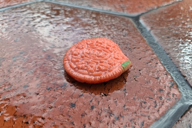 Discarded pink Oreo cookie