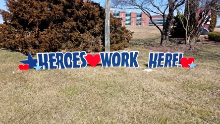 "Heroes work here!" sign