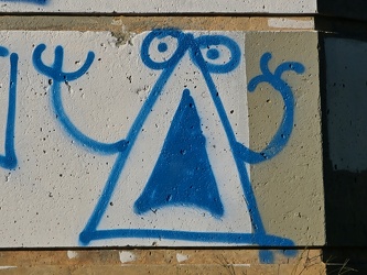 Triangle graffiti on a bridge pier