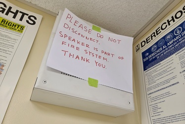 Handwritten sign on a speaker