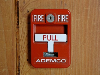 Fire alarm pull station in museum building