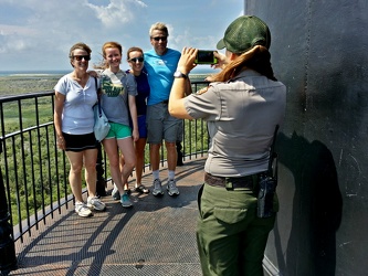 Park ranger taking a photo of a family