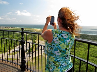 Woman taking photo from Cape Hatteras Lighthouse