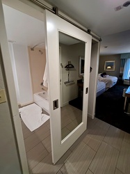 Barn door between bathroom and closet at the Hampton Inn in Goldsboro, North Carolina