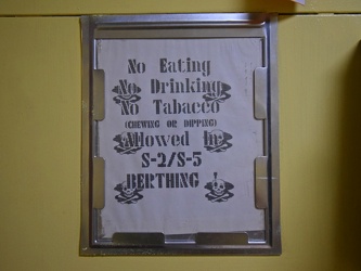 Sign prohibiting eating, drinking, and use of tobacco on USS Wisconsin