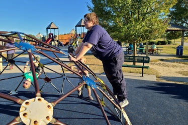 Elyse scales a dome climber