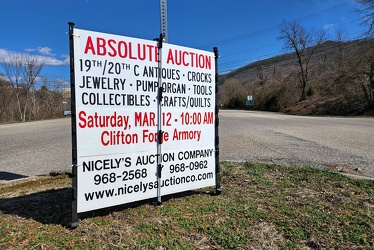 Sign advertising an auction