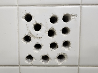 Holes drilled into a tile