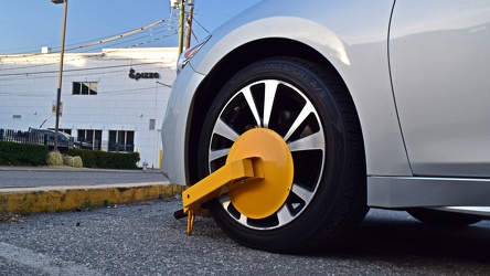 Nissan Maxima with booted wheel [01]