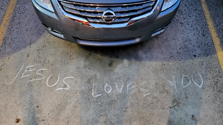 "JESUS LOVES YOU" in chalk at Sheetz