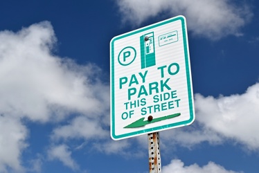 "Pay to park, this side of street"