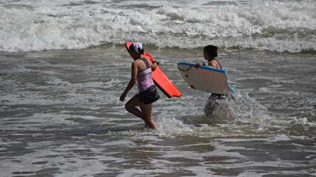 Two women with boogie boards