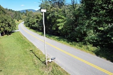 Mailbox atop a tall pole [01]