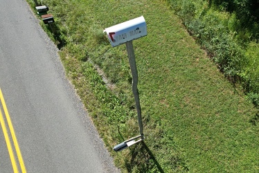 Mailbox atop a tall pole [02]