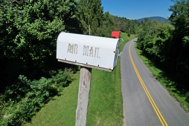 Mailbox atop a tall pole [03]