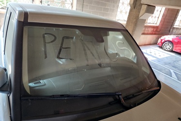 Abandoned vehicle in New Street parking garage with writing in the dirt [01]