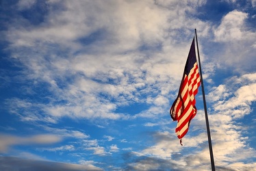 American flag over Frederick in late afternoon