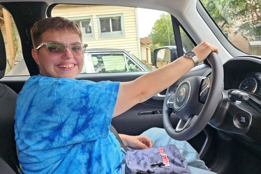 Elyse sits in the driver's seat of the Renegade