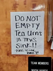 "Do not empty tea urns in this sink!!"