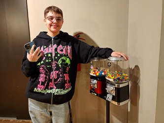 Elyse poses with two vending machines