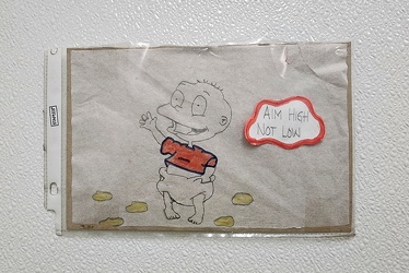 Tommy Pickles, reminding restroom users of proper etiquette