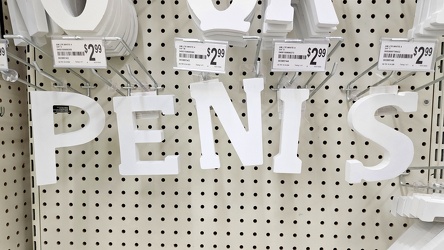 Spelling out "PENIS" on the rack of letters at Michaels