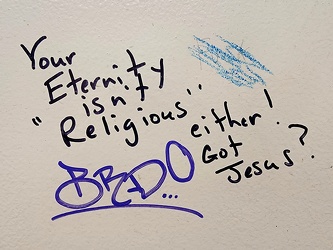 Religious restroom stall graffiti