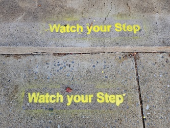 "Watch your Step" pavement markings