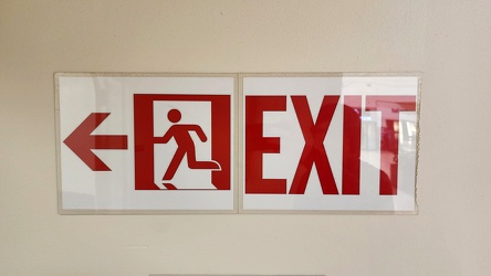 Running man exit sign at Christiana Mall