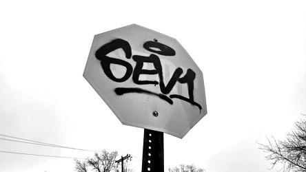 Faded and tagged stop sign in Langhorne, Pennsylvania