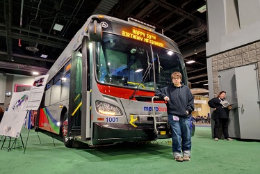 Elyse stands with WMATA bus 1001