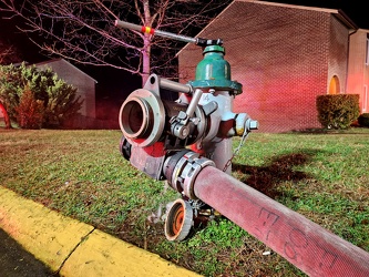 Fire hydrant with hose attached