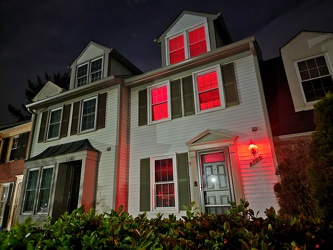 Townhouse lit up in red