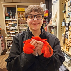 Elyse holds a crab at Cracker Barrel