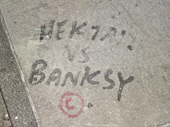 "Hektad vs. Banksy" sidewalk graffiti