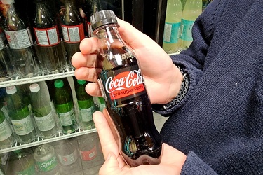 Elyse holds a tiny bottle of Coke Zero [02]