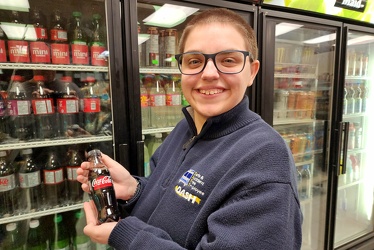 Elyse holds a tiny bottle of Coke Zero [01]