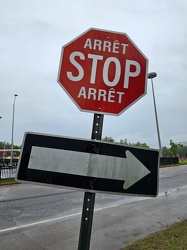 Bilingual stop sign and one way sign