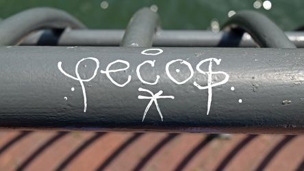 "Pecos" graffiti on a railing