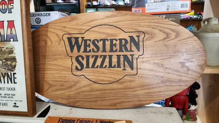 Wooden Western Sizzlin sign at Black Dog Salvage