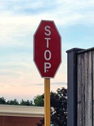 Stop sign with vertical text