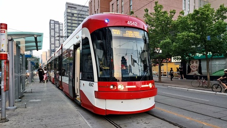 Toronto streetcar 4542 services College Street at Spadina Avenue