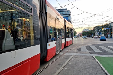 Toronto streetcar 4542 departs from College Street at Spadina Avenue