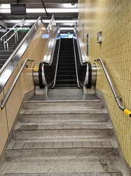 Stairs leading to an escalator at Christie station