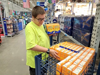 Elyse rummages through the Scrub Daddy rack